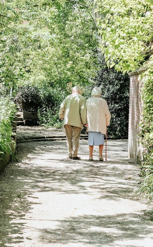 Couple walking in the garden