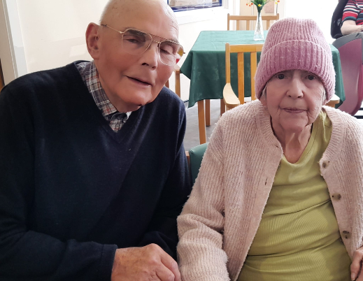 Residents sitting in the dining area