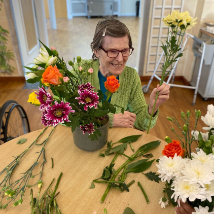 Resident arranging flowers