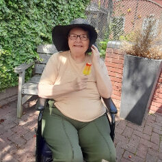 elderly woman outdoor with an ice lolly